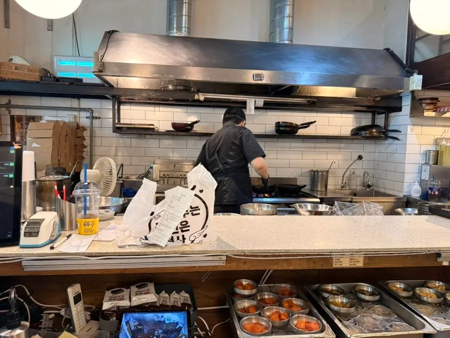 Interior of Cafe Dongyi Branch 1 with open-kitchen layout