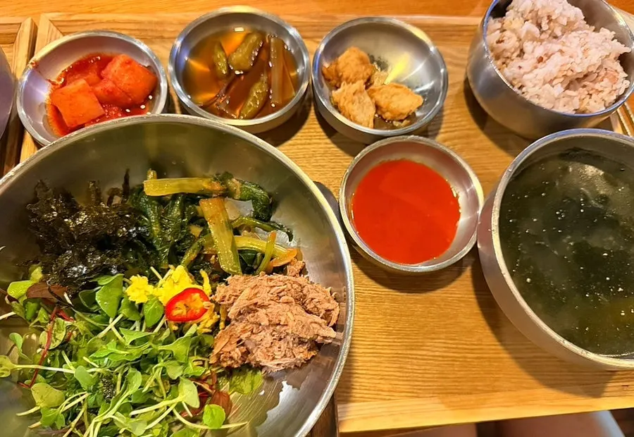 Yeolmu tuna bibimbap served with seaweed soup and side dishes