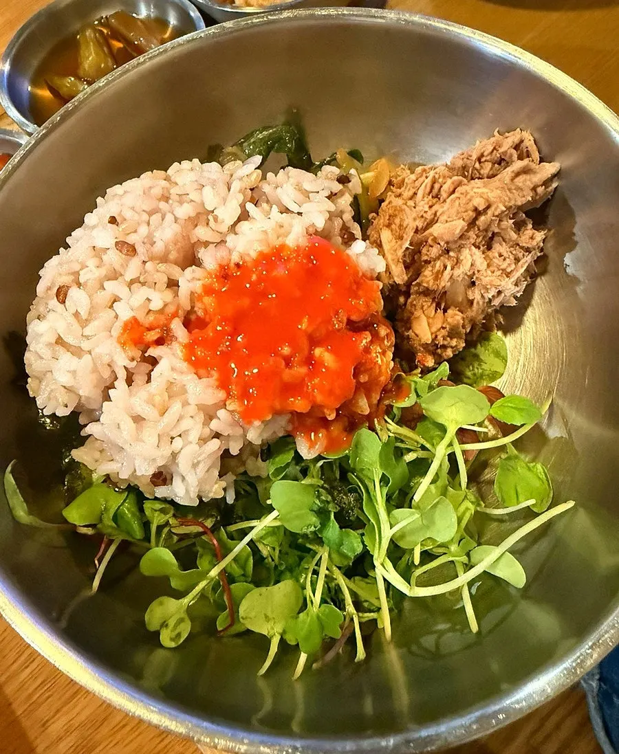 Close-up of yeolmu kimchi bibimbap before mixing