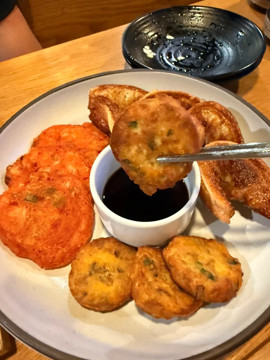 Assorted pan-fried jeon and dumplings ordered as sides
