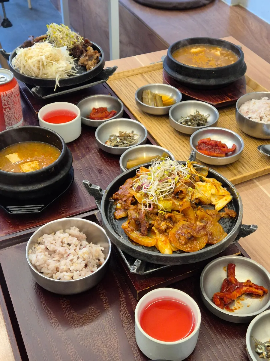 Three Korean set meals laid out on the table