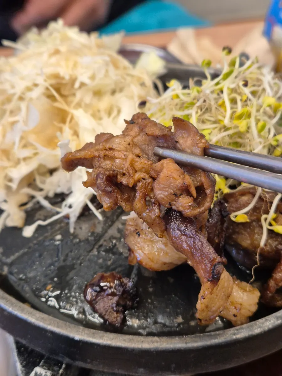 Pork bulgogi served on a tabletop brazier