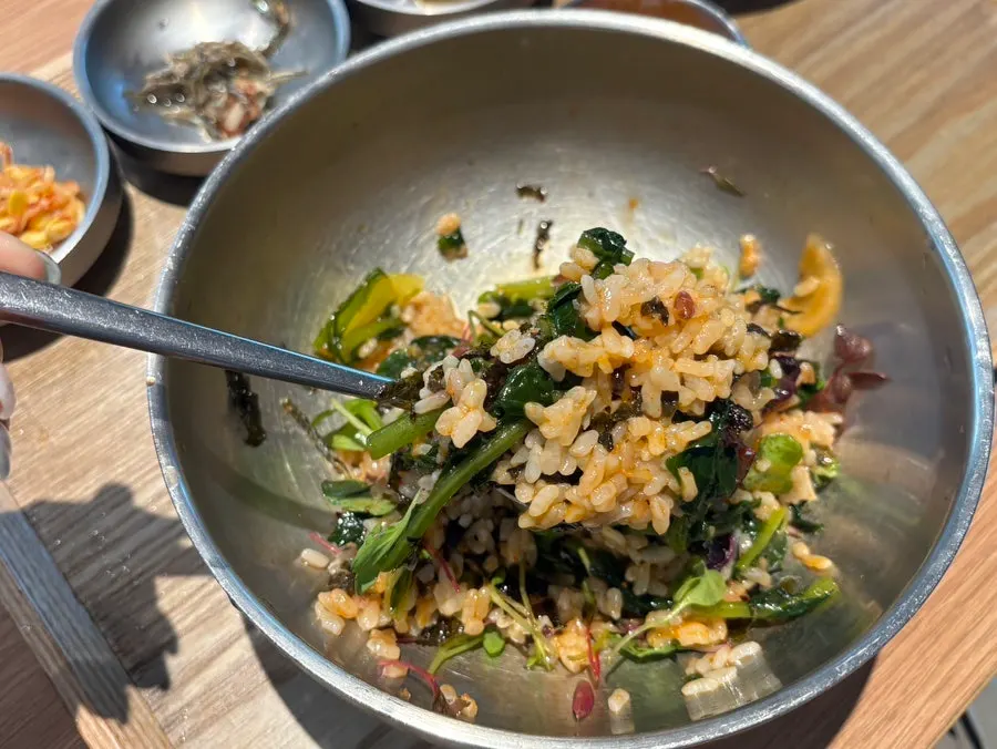 Close-up of bibimbap topped with yeolmu kimchi