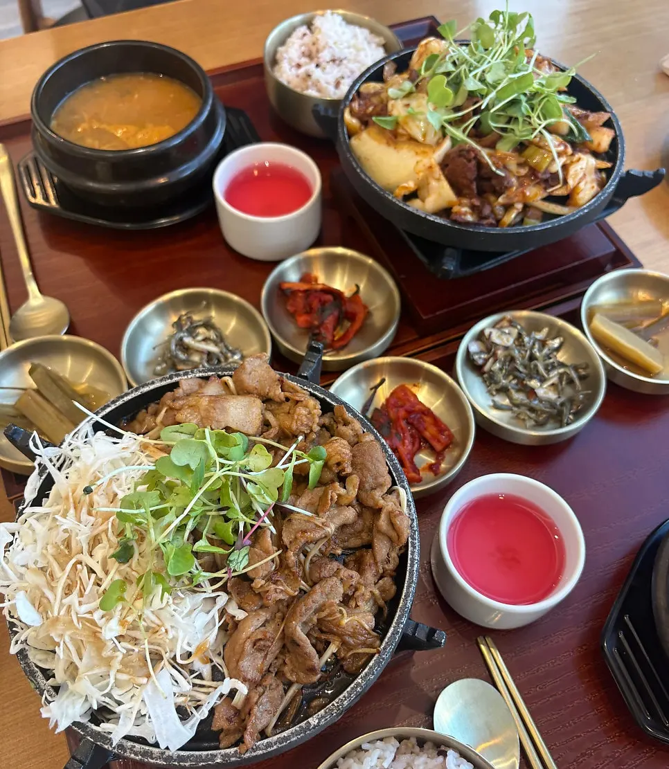 Grilled pork and bulgogi topped with sprouts