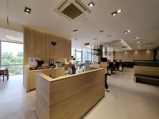 Spacious table seating in the main hall of Cafe Dongi