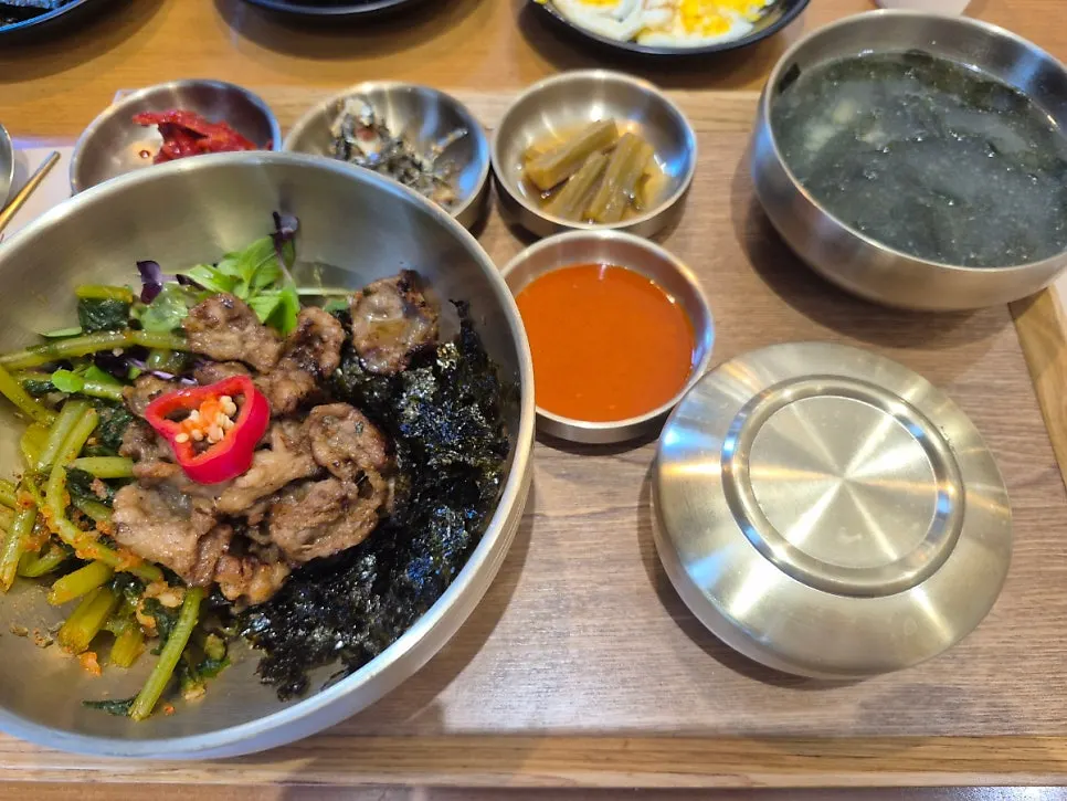 Bulgogi yeolmu bibimbap topped with yeolmu kimchi