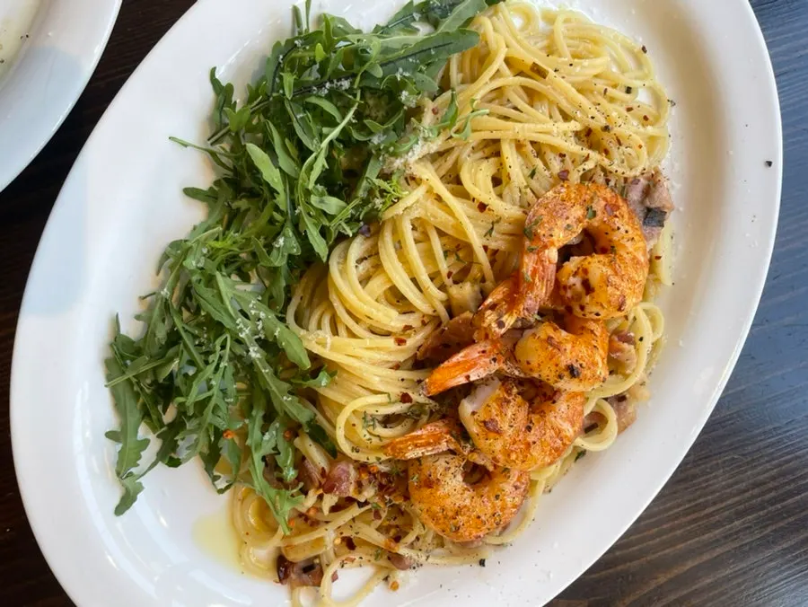 A plate of anchovy bacon pasta
