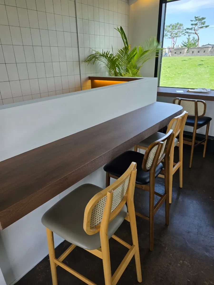 Second-floor seating with window view