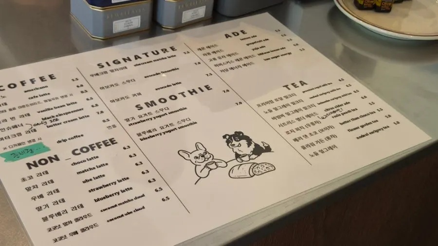 Coffee and non-coffee menu board at Caffeine Focus