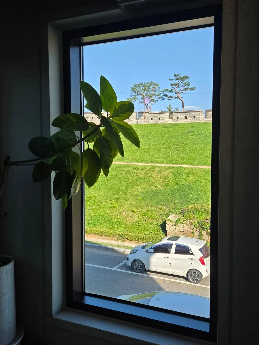 Fortress wall and grassy view from the 2nd floor window at Caffeine Focus