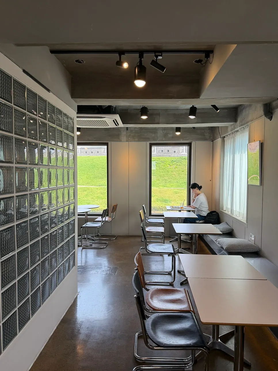Floor-to-ceiling windows and spacious interior seating at Caffeine Focus