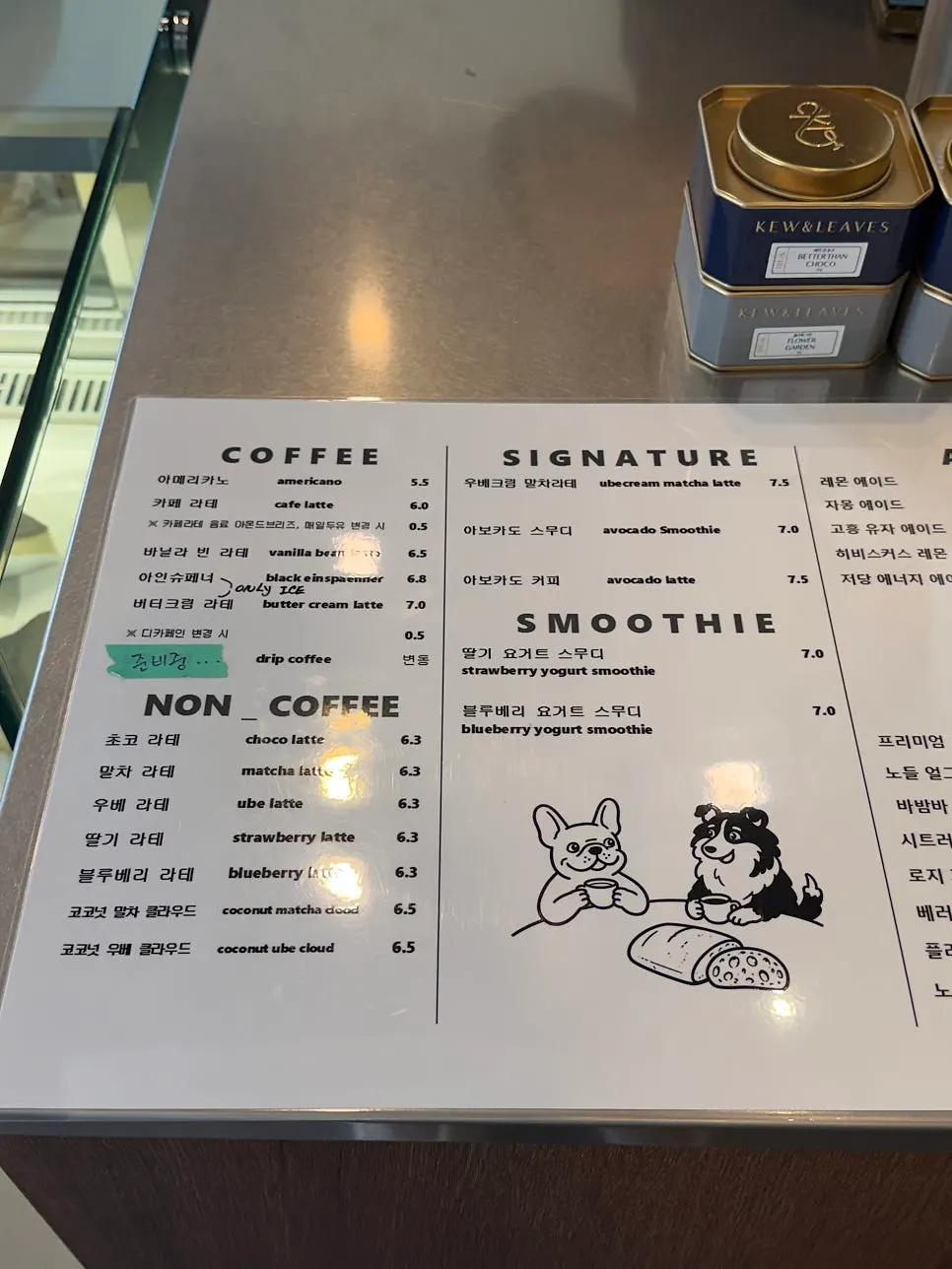Drinks and dessert menu board at Caffeine Focus