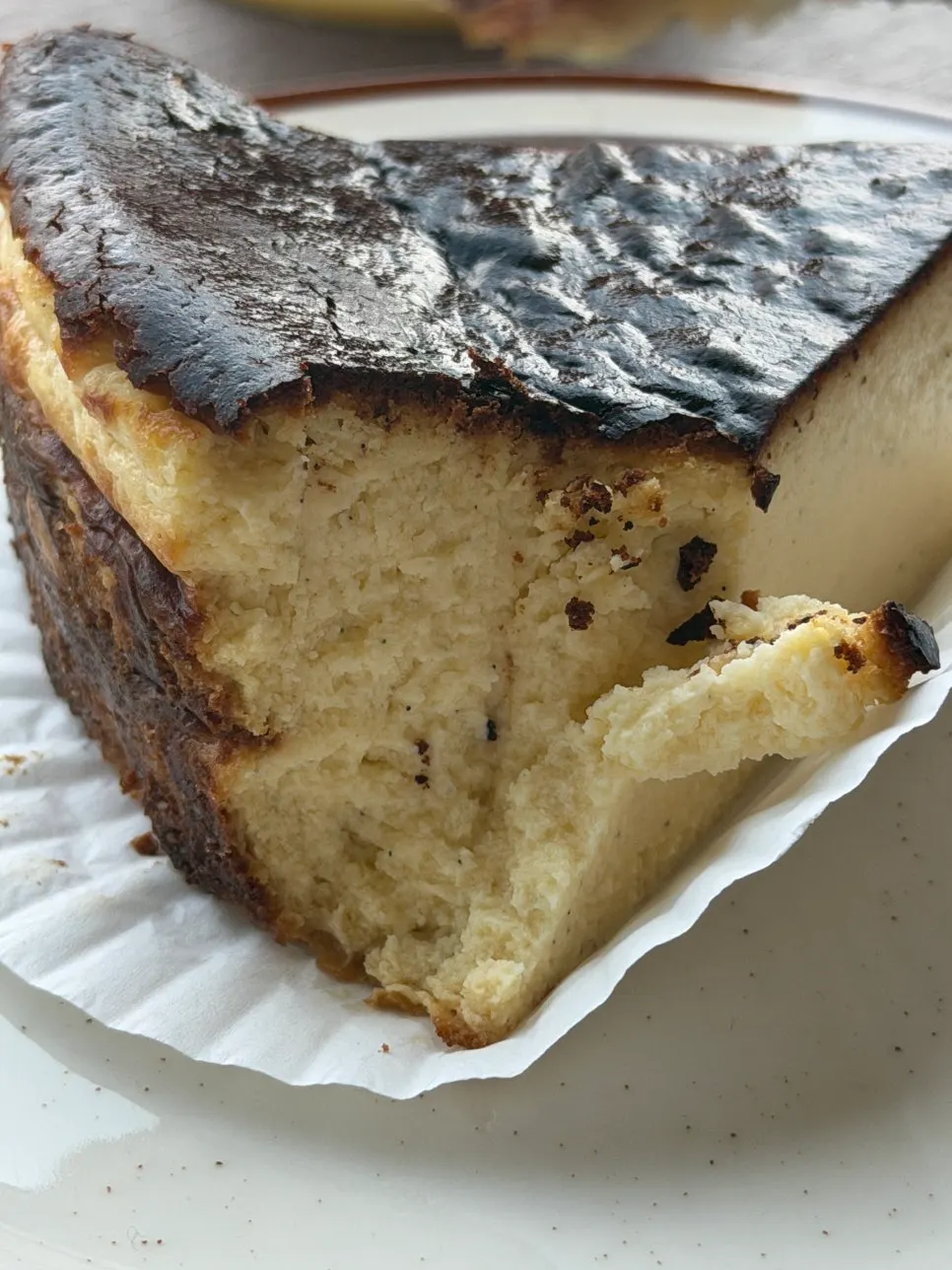 Cross-section of the Basque cheesecake cut with a fork