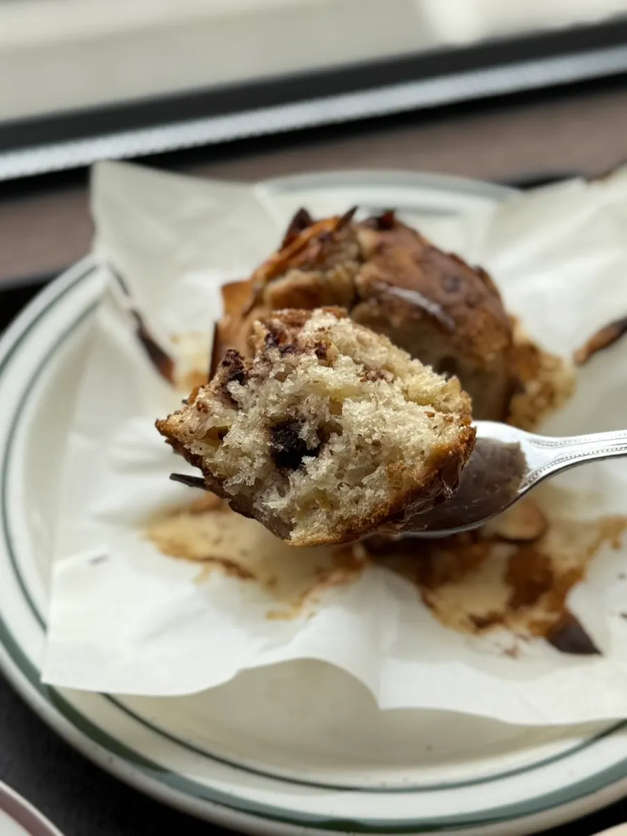 Banana muffin served alongside coffee