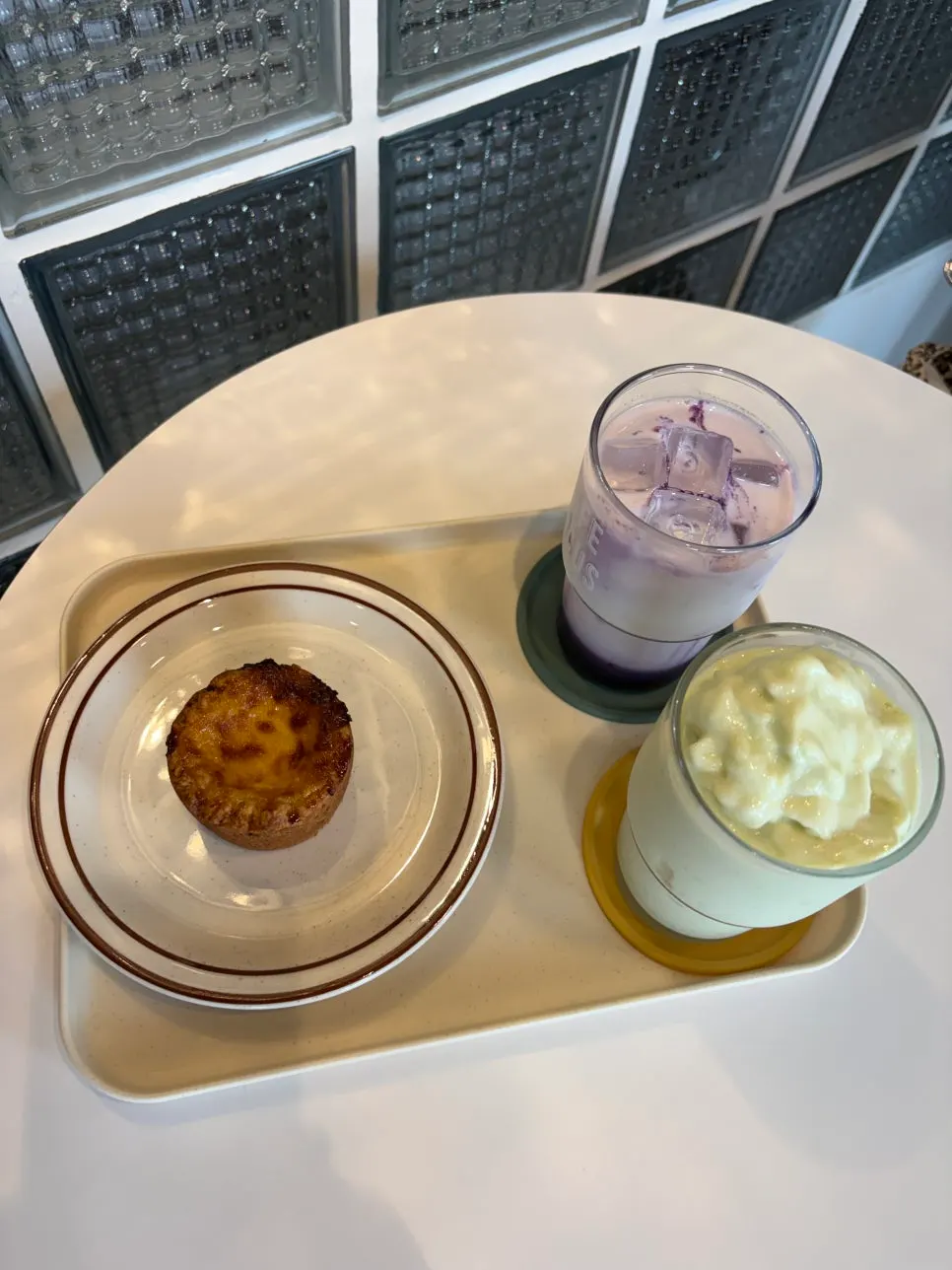 Table at Caffeine Focus with bakery items and drinks enjoyed together