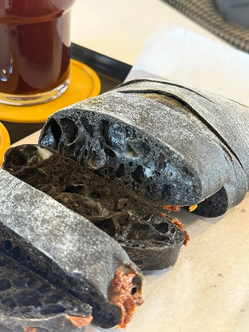 Close-up of the black squid ink cheese ciabatta dough