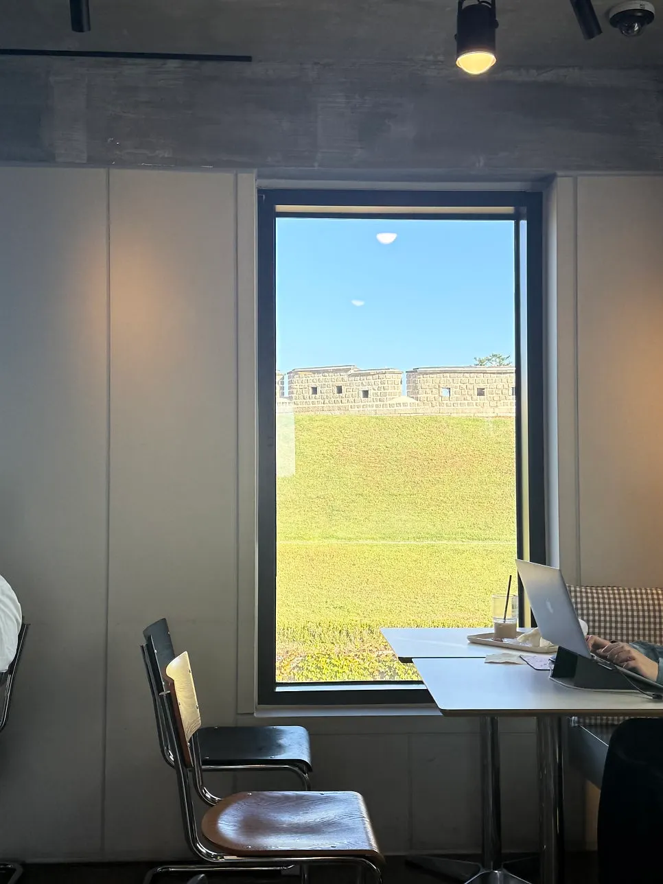 Drinks on a window table with the fortress wall view