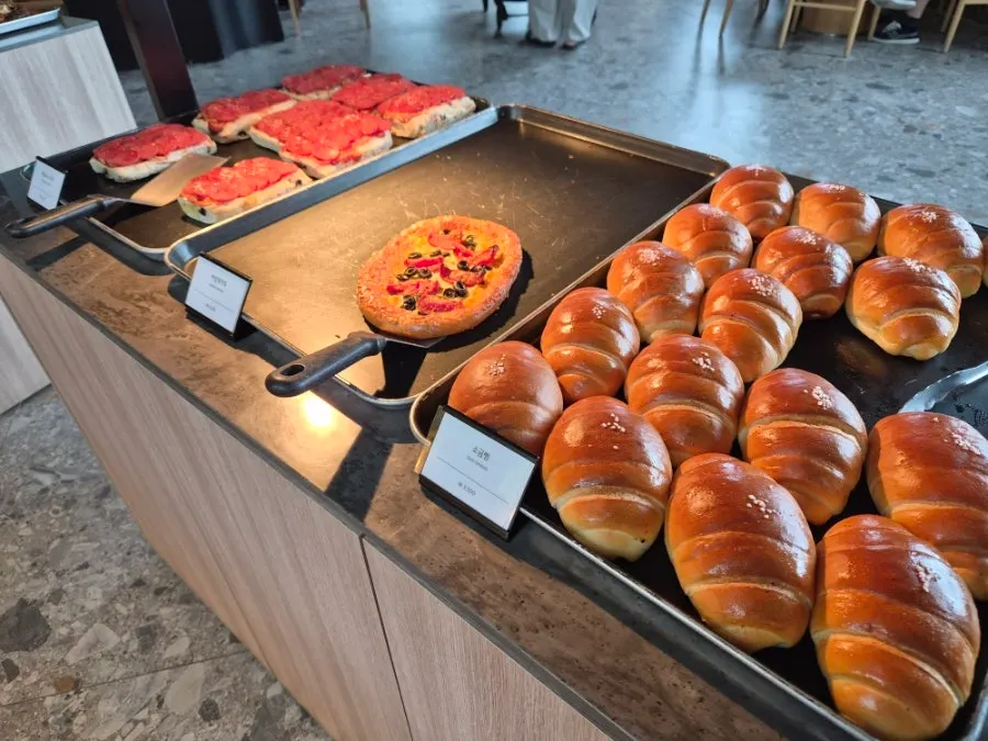Pizza and salt bread on display at MUG