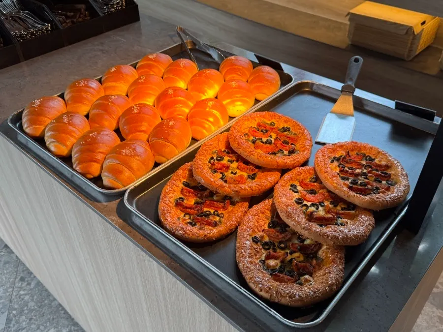 Freshly baked bakery items on the wood-toned display