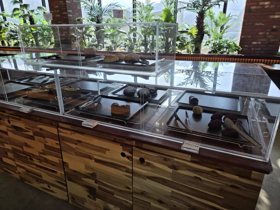 Variety of breads on display at bakery café Cafe Neorae