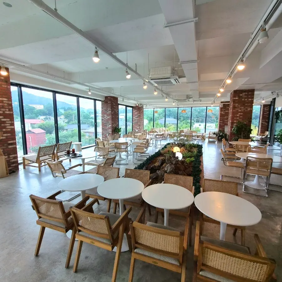 Interior tables and window seats at Cafe Neorae