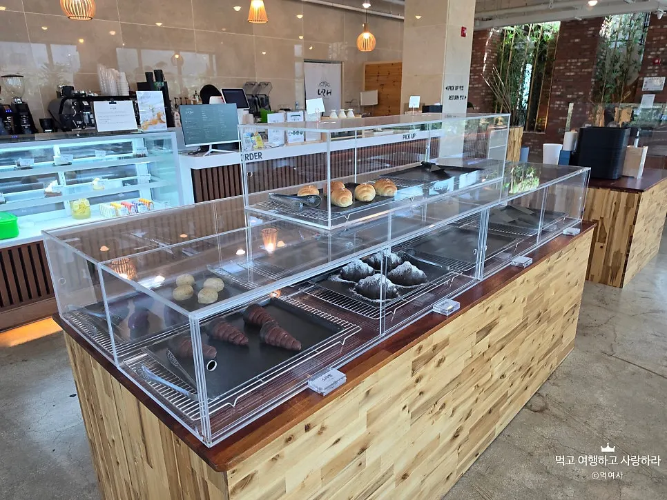 Bread and desserts in the display case at Cafe Neorae