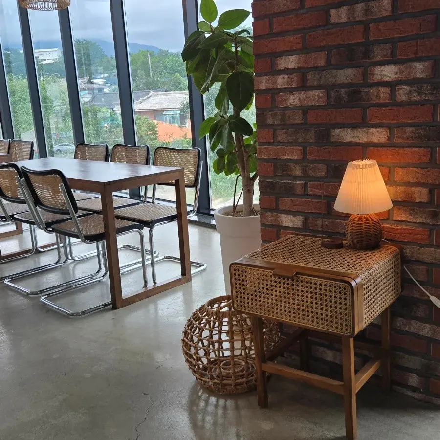 Cafe Neorae seating with wood interior and moody lighting