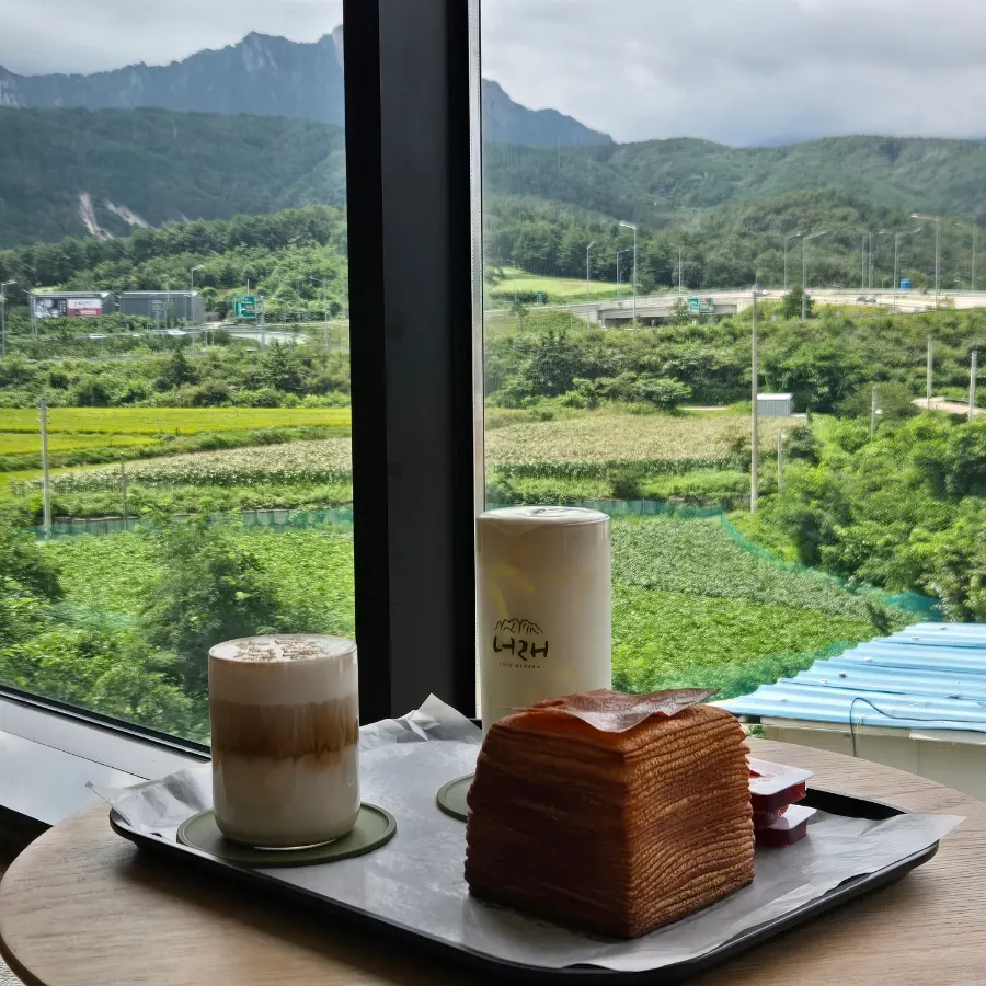 Table spread with Neorae Latte, Chodang corn latte, and tissue bread