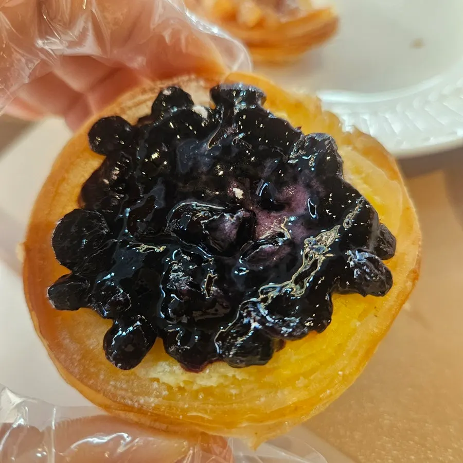 Cross-section of blueberry cream cheese egg tart