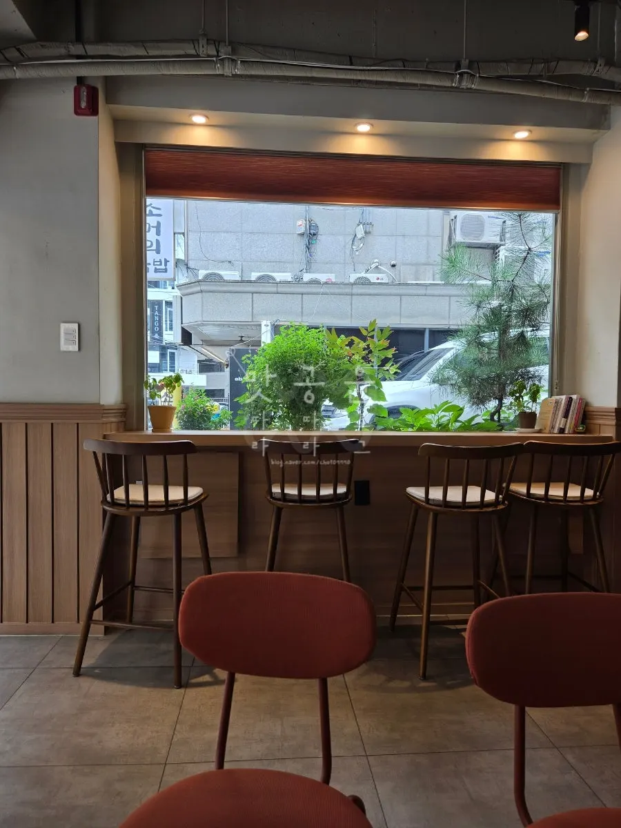 Wood-toned seating inside Cafe Ssum