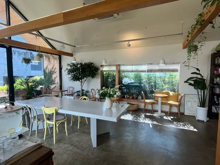 Spacious café area with large and small tables