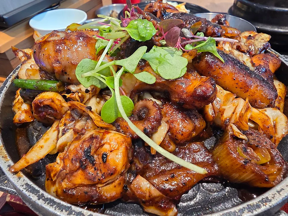 Octopus stir-fry, doenjang jjigae, and basic side dishes