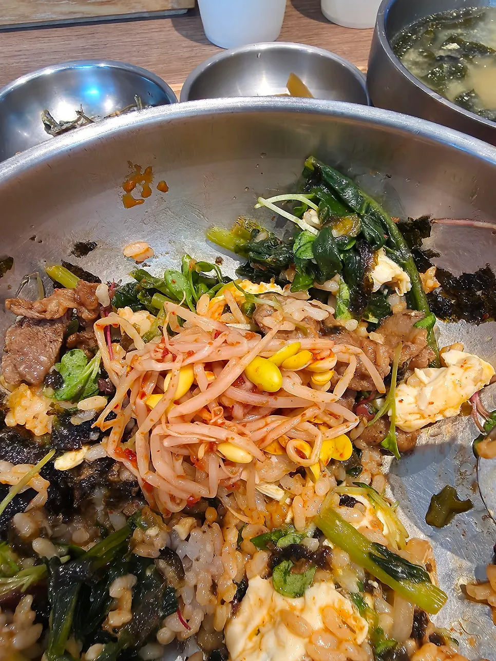 Yeolmu bibimbap mixed with bean sprouts