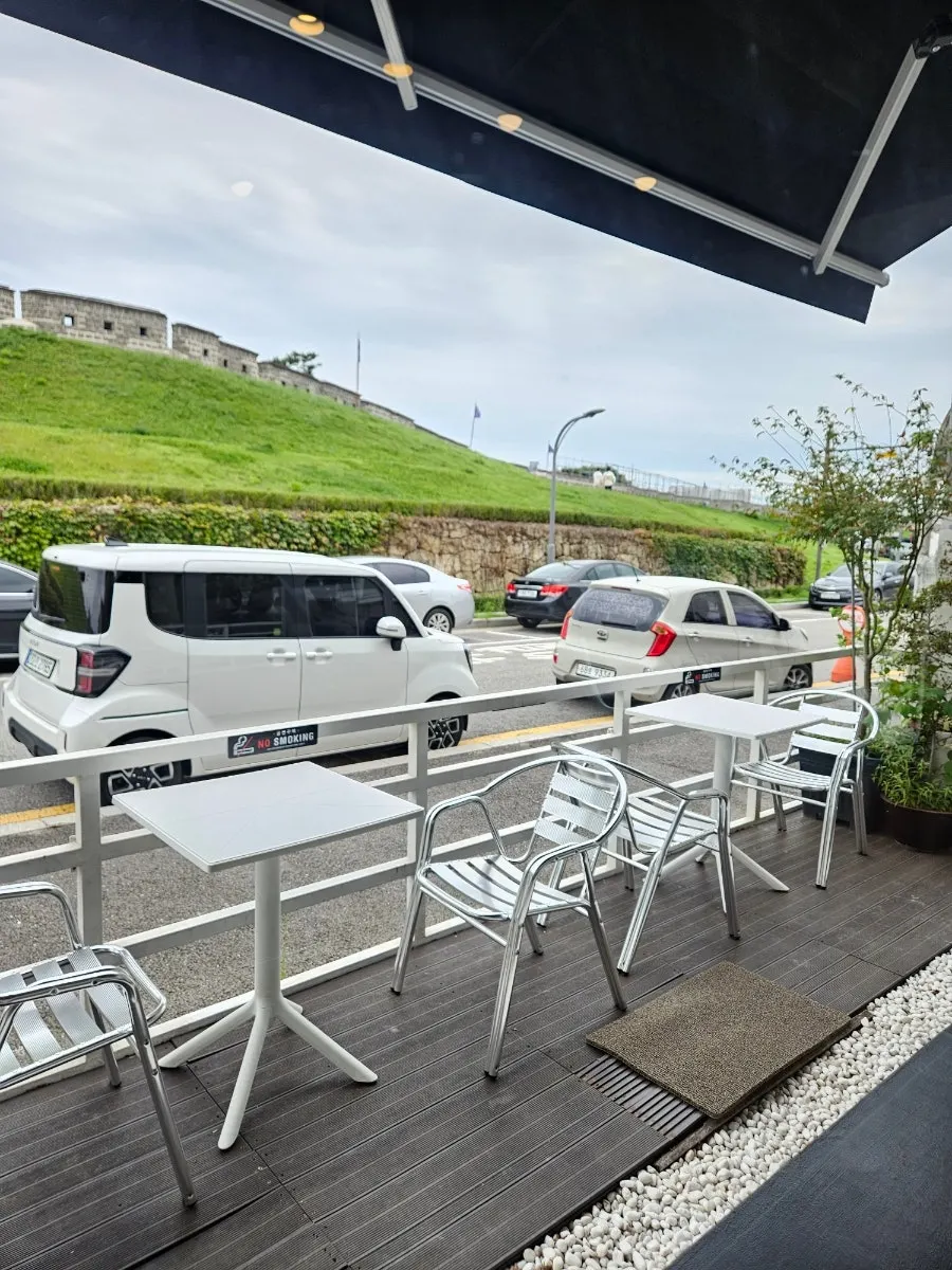 Hwaseong Fortress wall seen from in front of Caffeine Focus