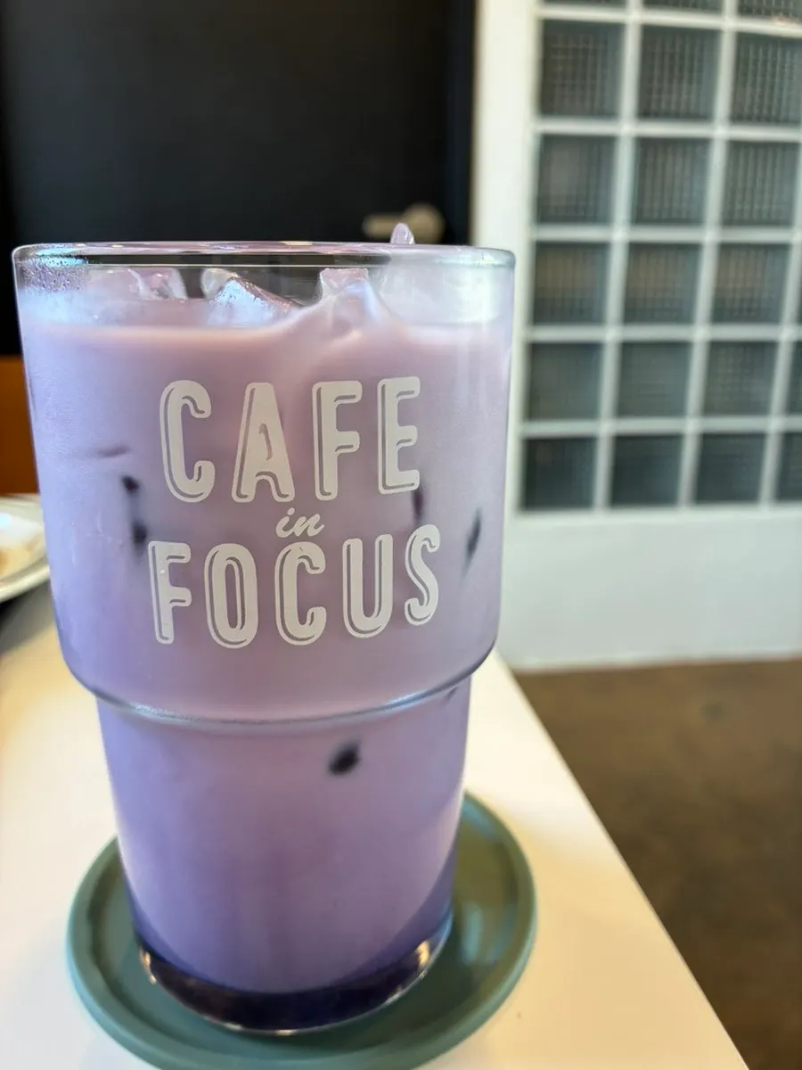 Exterior view of Caffeine Focus, a café with a Hwaseong Fortress wall view