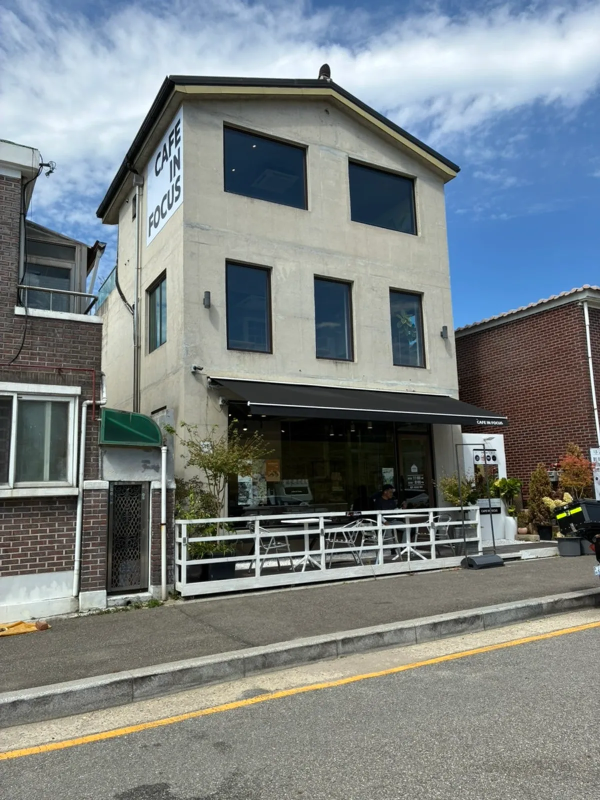 Exterior of Caffeine Focus and the parking space out front