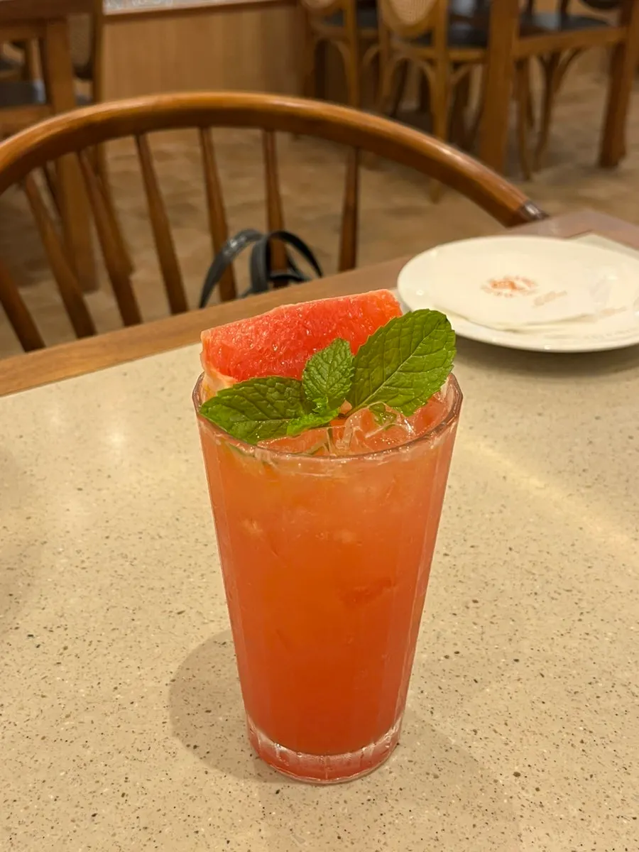 Close-up of soda ade with visible grapefruit flesh