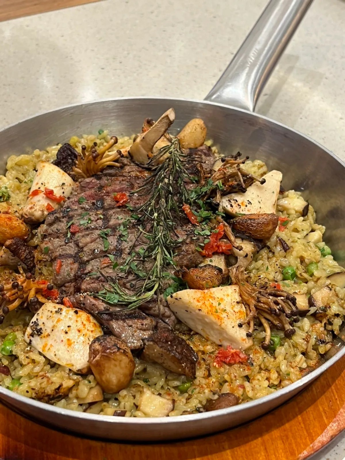 A pan of hanwoo stk mushroom paella