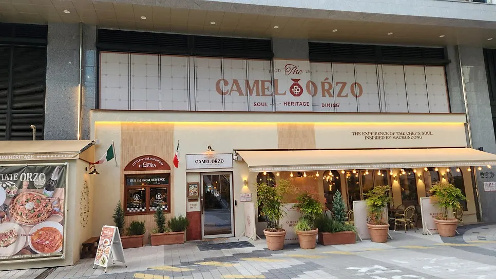 Wide exterior view of the large Camel Orzo restaurant in Sangmu