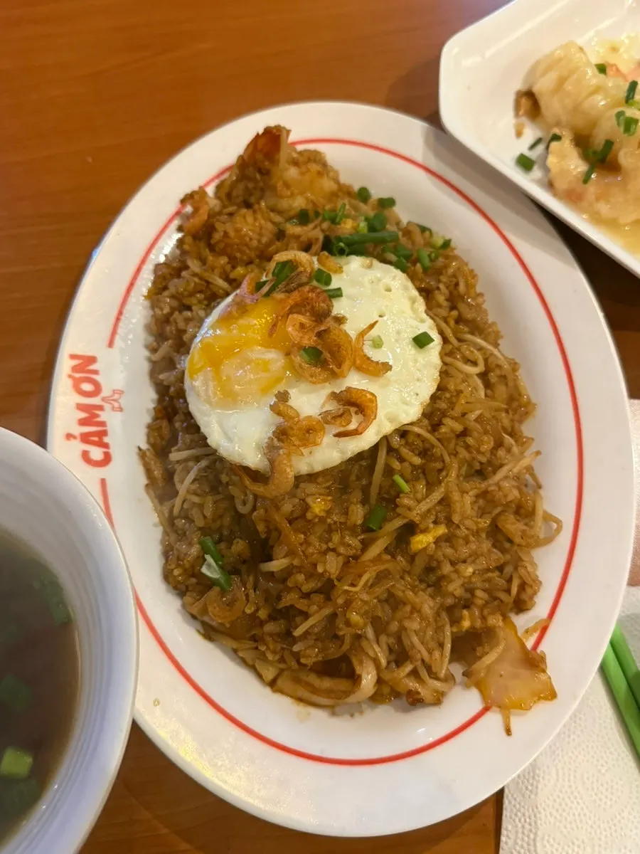A plate of Kkamon seafood fried rice