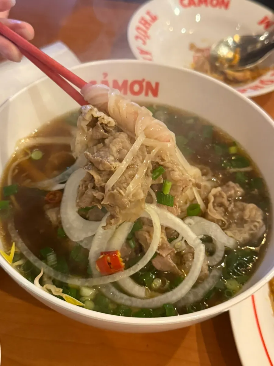 Kkamon pho served alongside fried rice