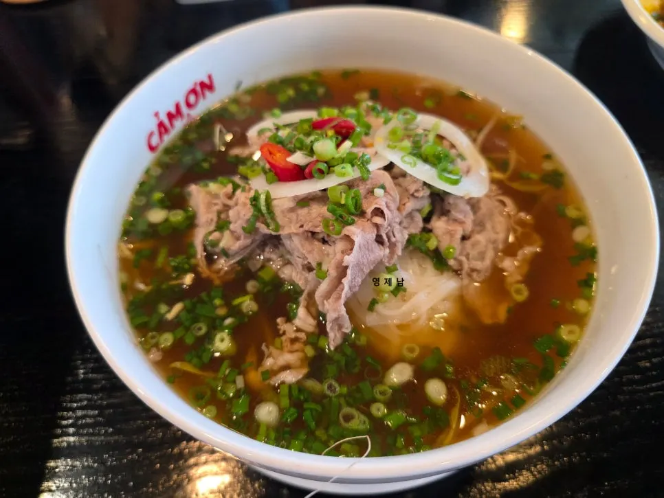 Steaming signature brisket pho