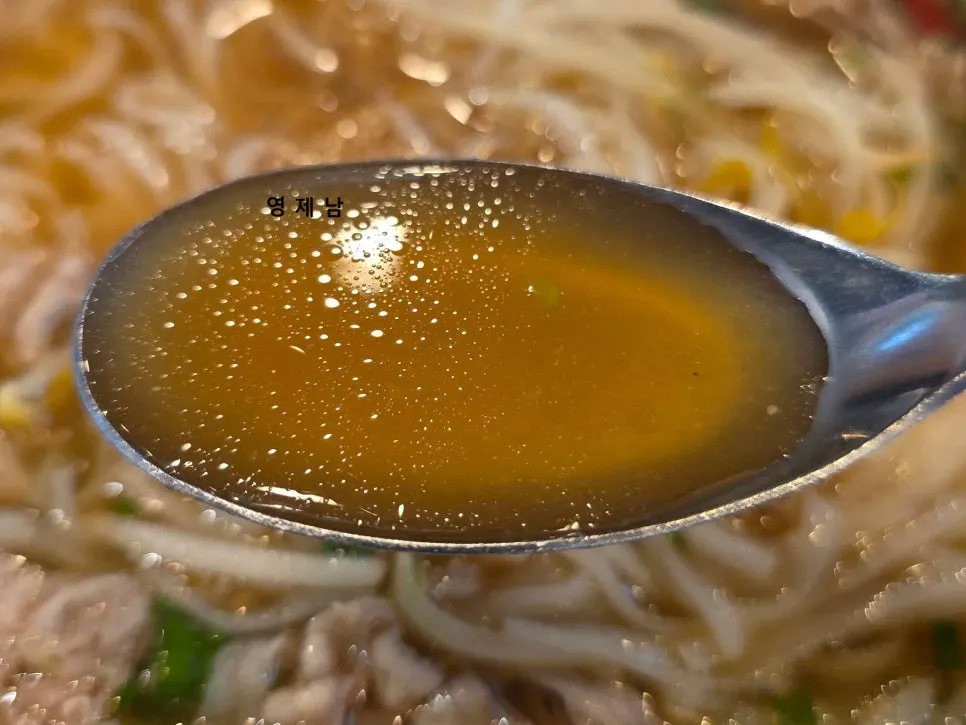 Chili sauce and hoisin served alongside the pho