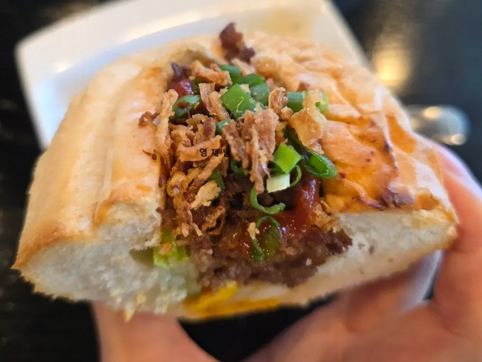 Cross-section of banh mi with meat and egg