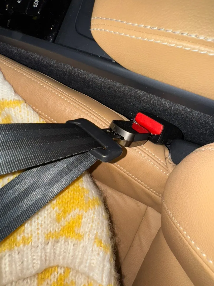 Seat belt clip checked for installation in a car seat