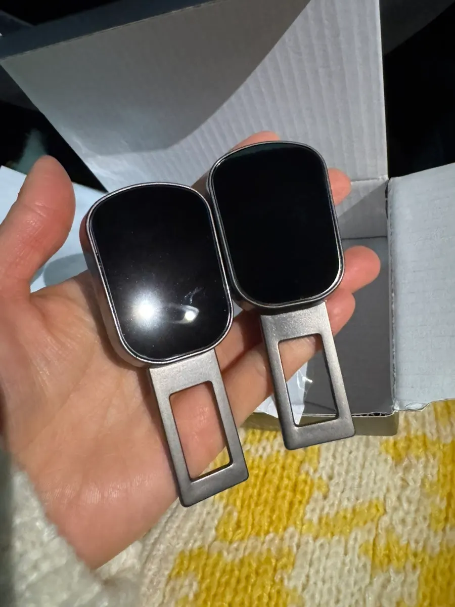Extension clip inserted into a seat belt and adjusted into position