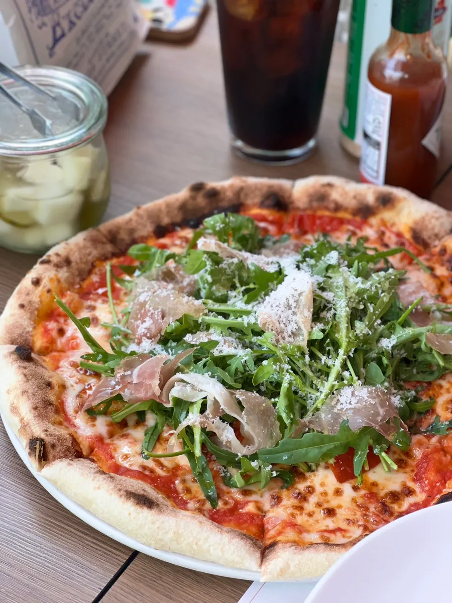 A pizza slice showing the chewy wood-fired dough