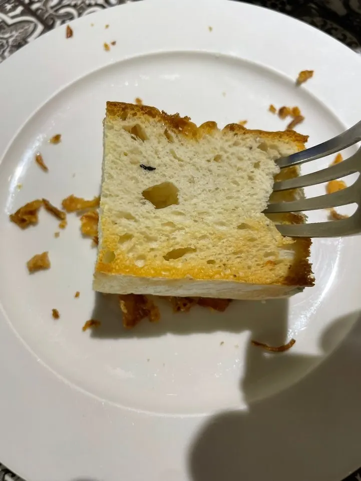 Starter bread topped with onion paste and honey