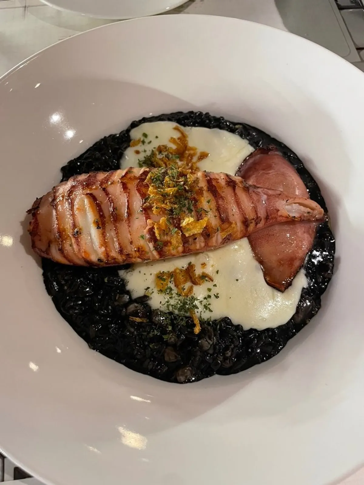 Casamil's squid ink risotto topped with whole squid