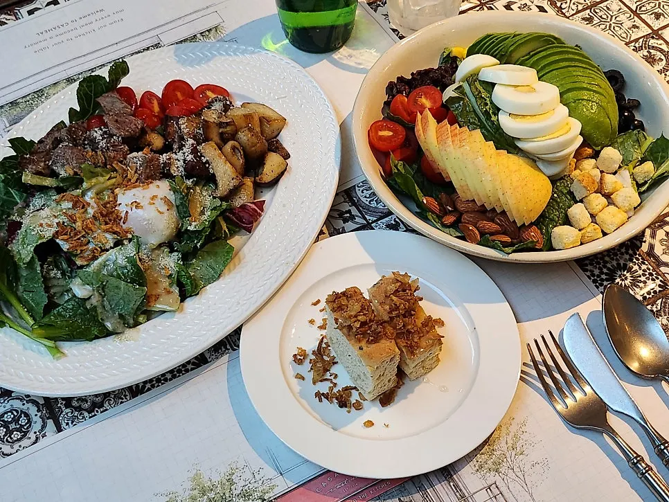 Casamil brunch table with cobb salad and beef mushroom salad